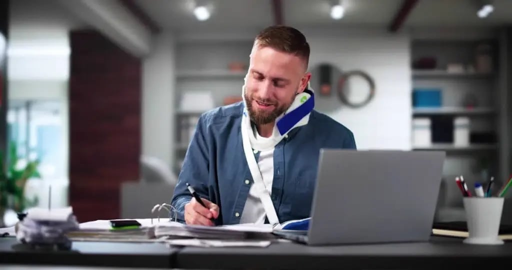 Injured Worker Sitting at Desk 
