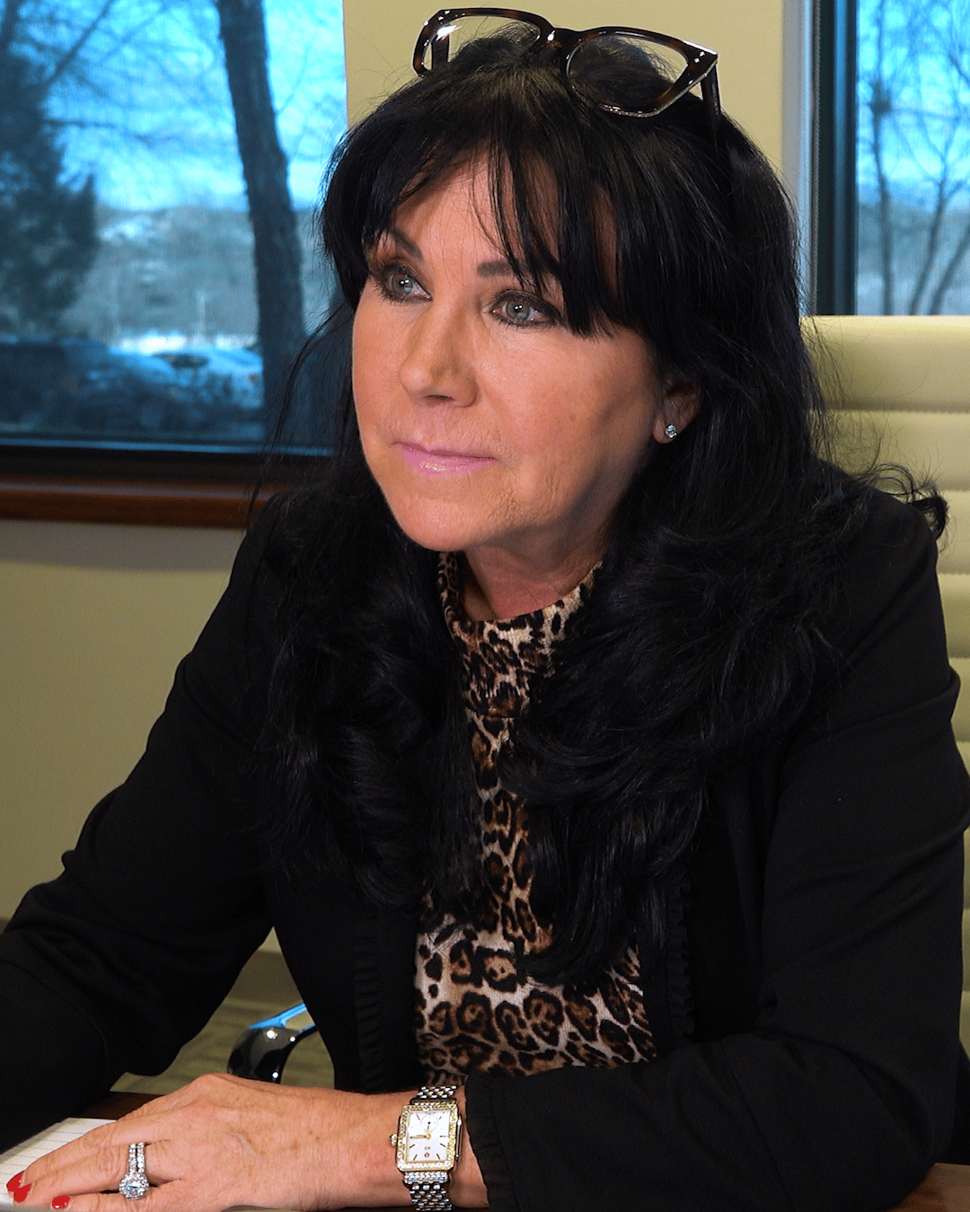 Professional portrait of Paula Robinson, attorney, wearing business attire and smiling at camera